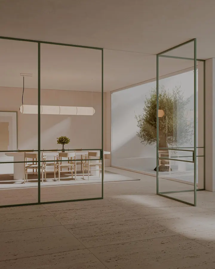 Cerramiento a medida en tono oliva, diseñado para definir el comedor sin perder luz ni continuidad visual.