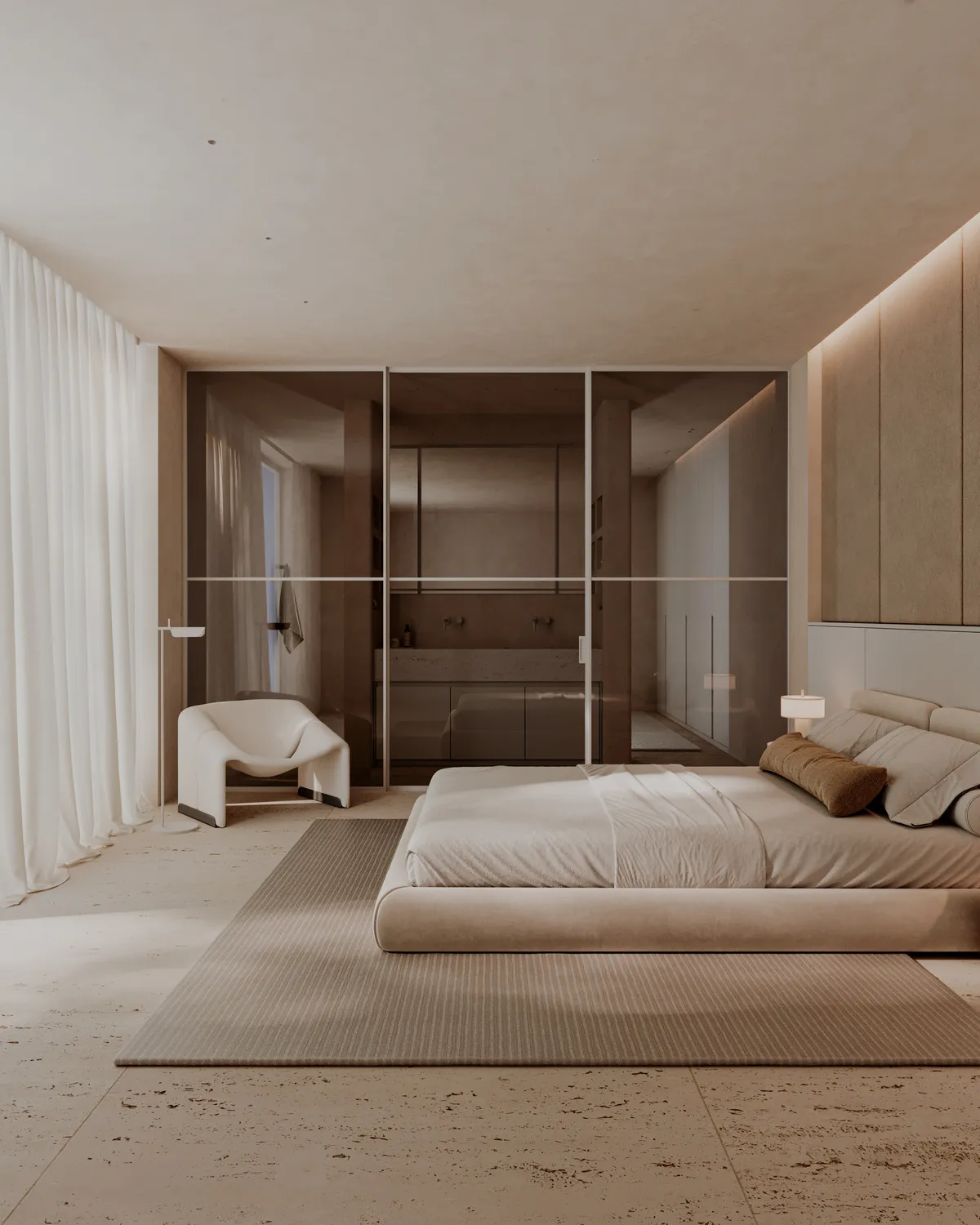 Modelo Grid: cerramiento de varias hojas de vidrio ahumado con perfil fino entre dormitorio y baño.